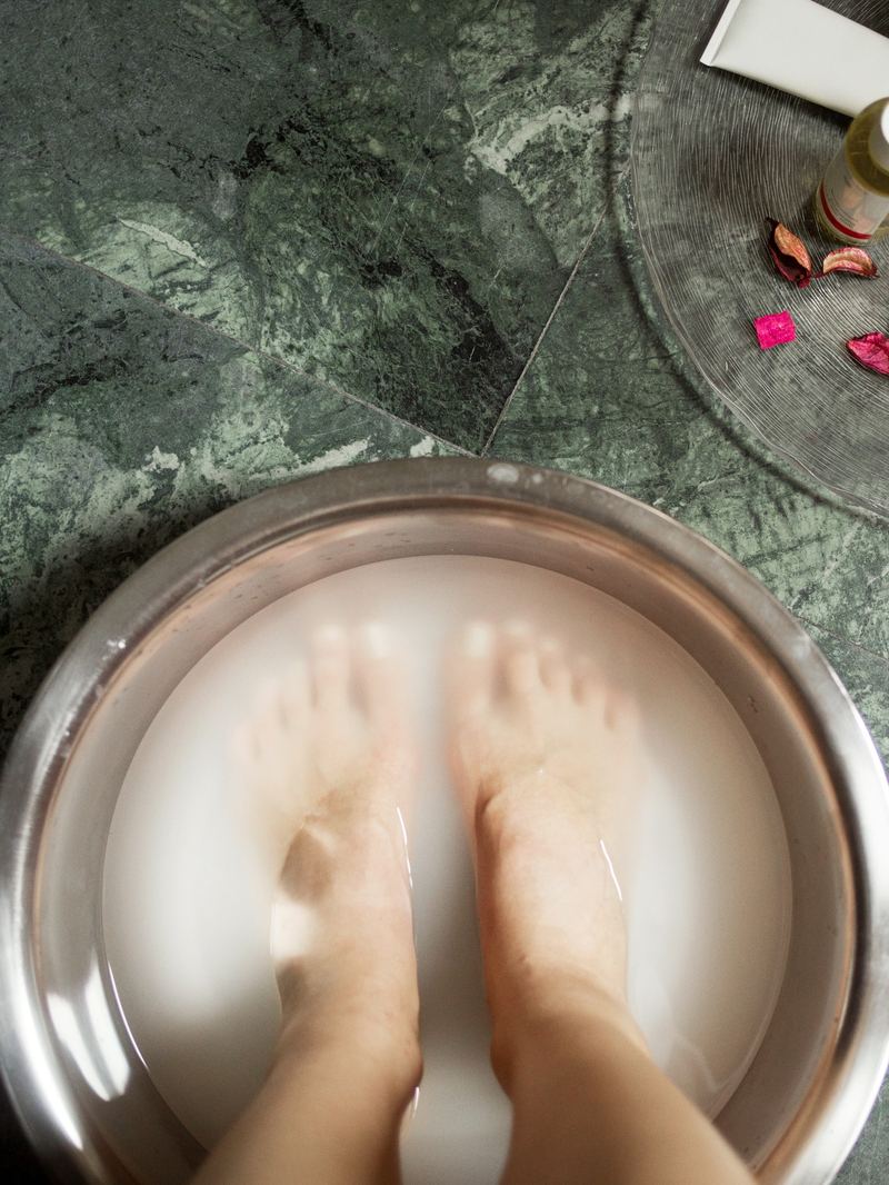 Feet soaking in a warm pedicure bath